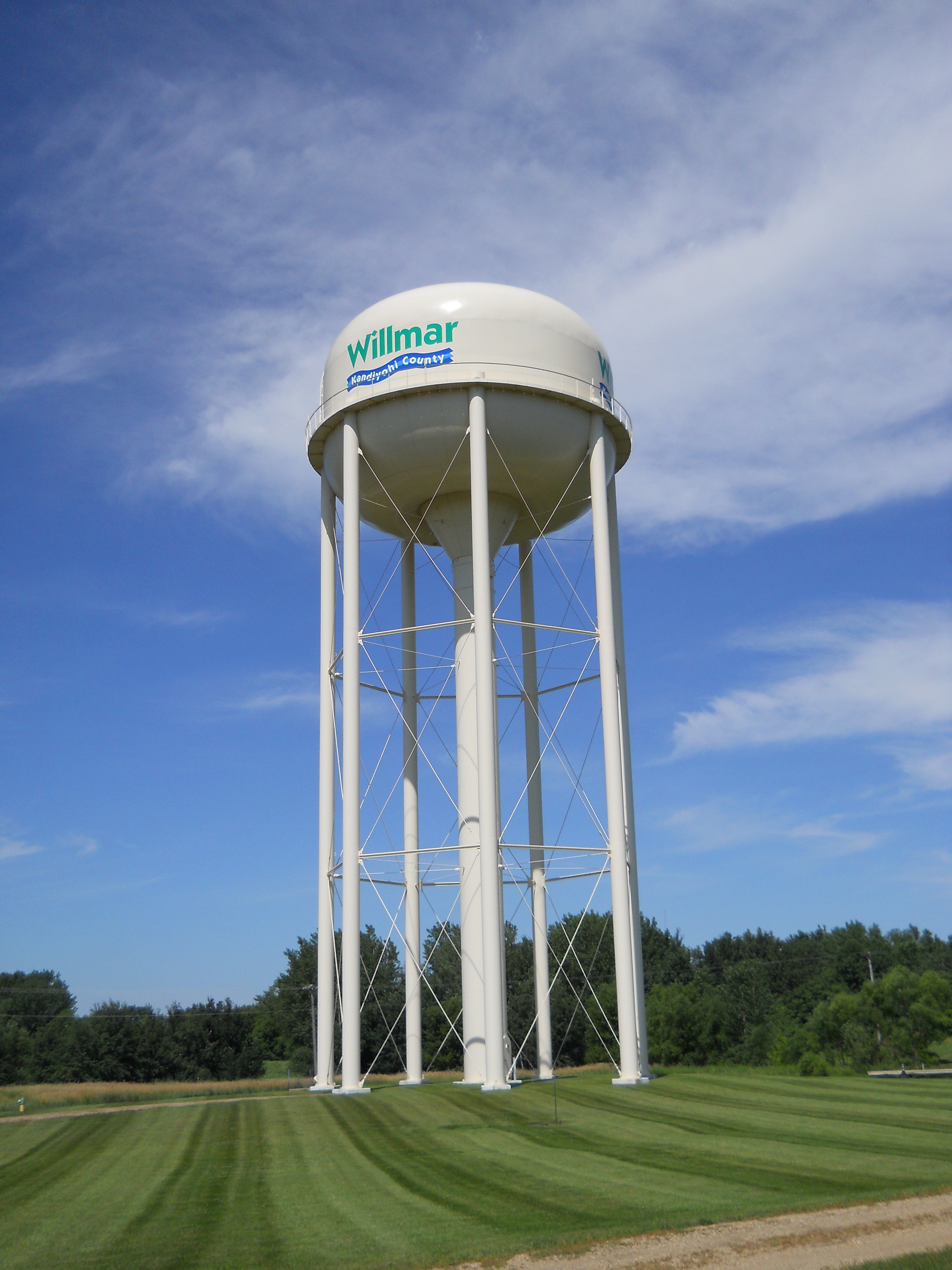 watertower Willmar water tower in green field with blue skies above